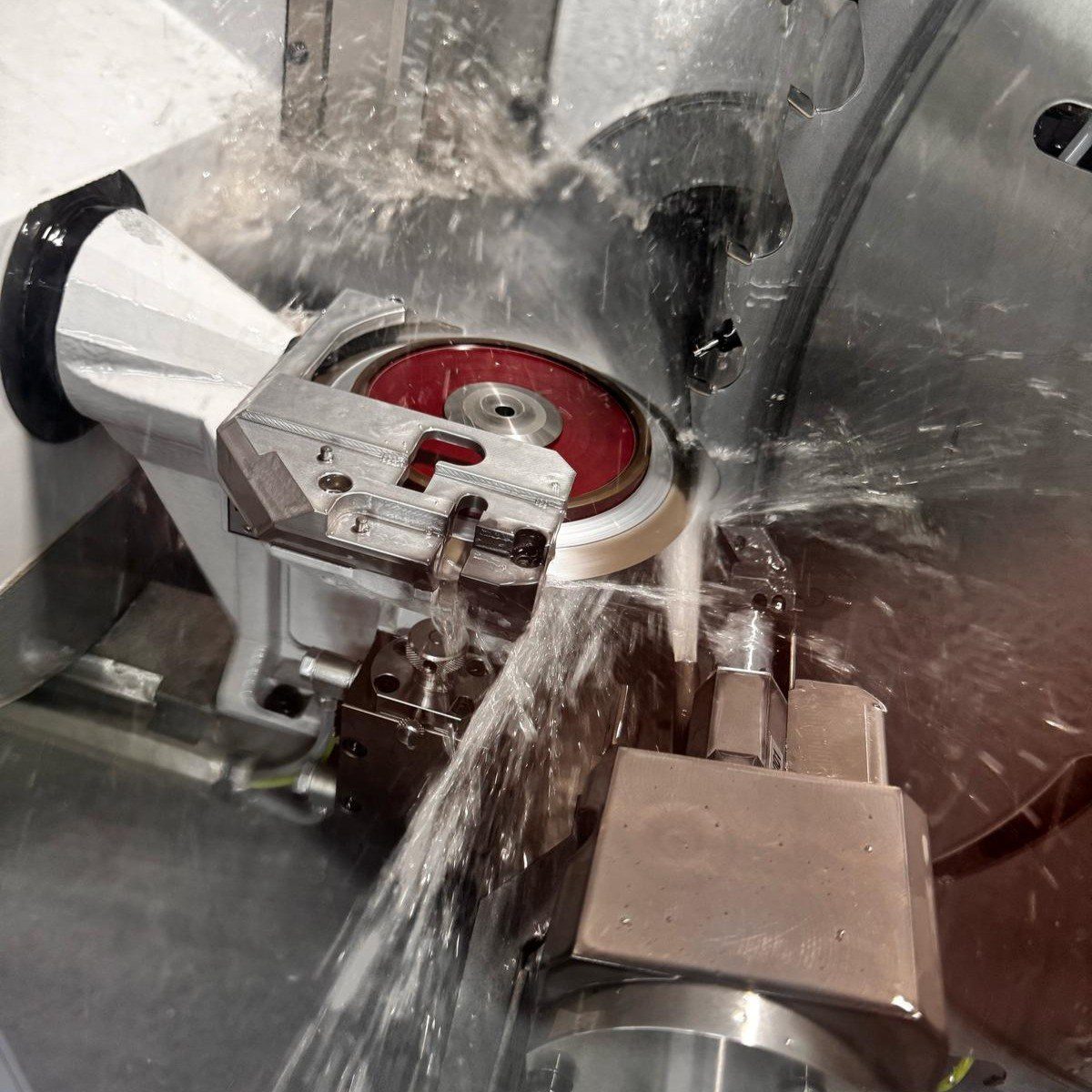 Grinding wheel at work on a circular saw blade